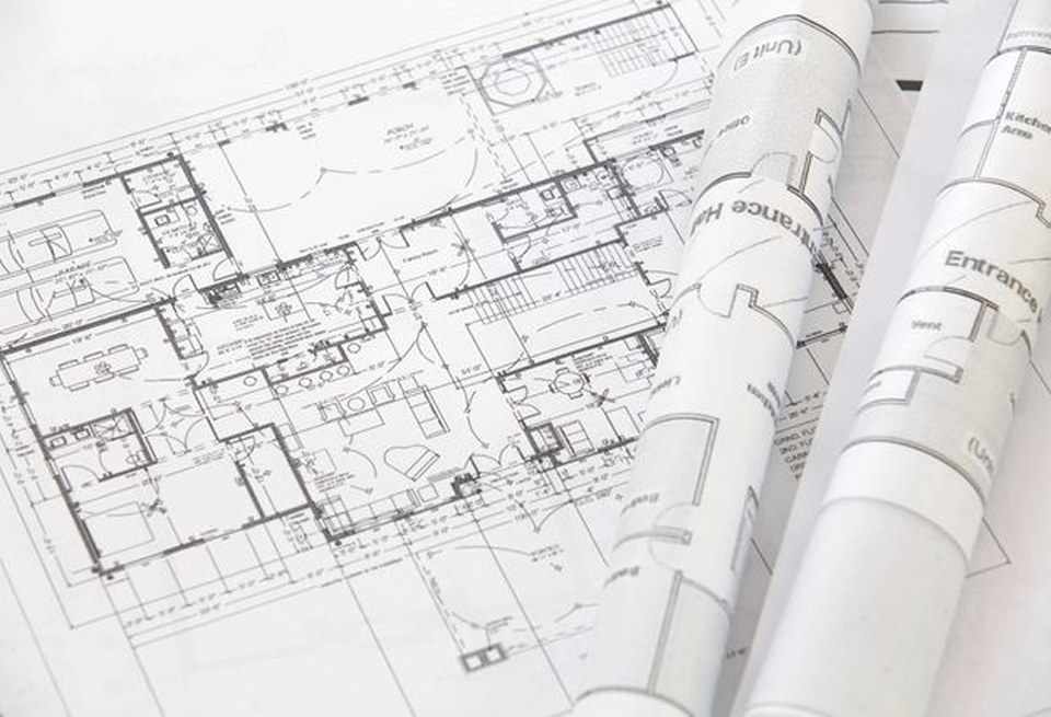 Architectural blueprints with detailed floor plans.